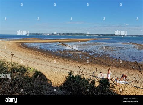 The Beach At Lepe Country Park At Low Tide Looking Across To The Isle Of Wight On A Sunny