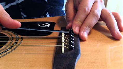 How To Remove Bridge Pins Easily Using A Spoon Acoustic Guitar Youtube