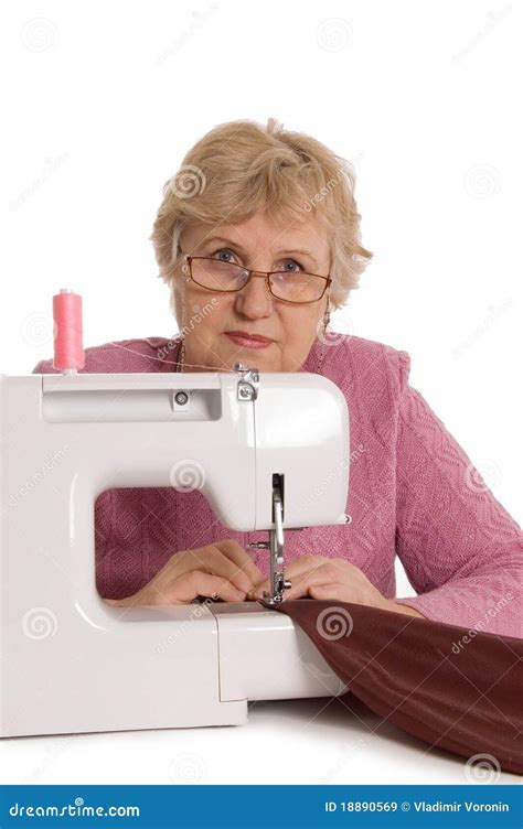 The Elderly Woman Sews On The Sewing Machine Stock Image Image Of