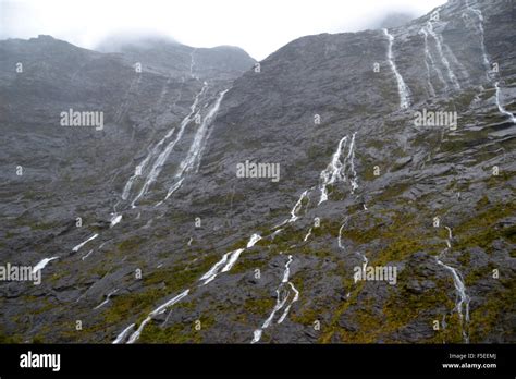 Glacier waterfalls on the road to Milford Sound, Fiordland National Park, South Island, New ...