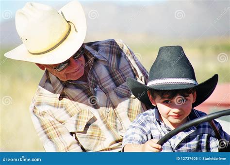 Learning To Drive A Tractor Stock Image Image Of Grandfather Cowboy