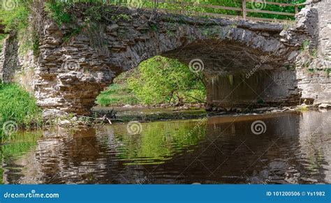 Old Stone Bridge Across Small Stream In The Woods Stock Photo Image