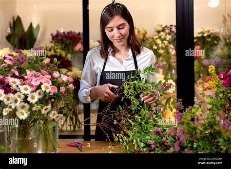 Photo Of Successful Modern Florist Wearing Apron Making Creating