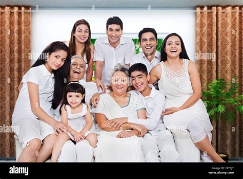 indian group Joint Family sitting sofa enjoy Stock Photo - Alamy