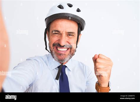 Middle Age Businessman Wearing Bike Helmet Make Selfie Over Isolated