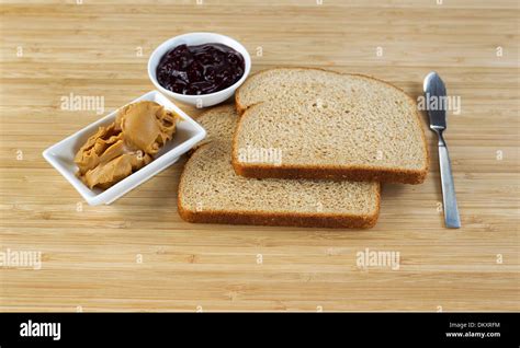 Horizontal Photo Of Peanut Butter And Jelly Sandwich Ingredients And Spread Knife With Natural