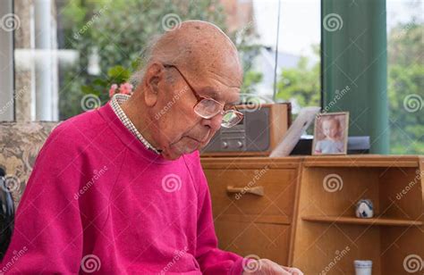 95 Years Old English Man Sitting In Chair In Domestic Environment