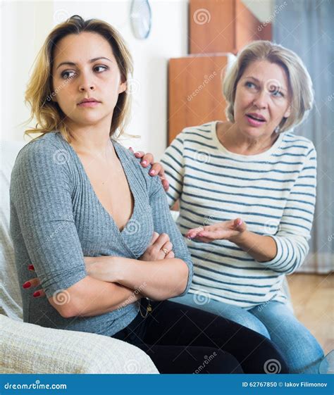 Senior Mother Screaming On Adult Daughter In Domestic Argument Stock