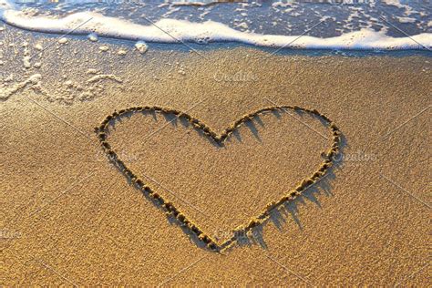 A Heart Drawn In The Sand At The Beach