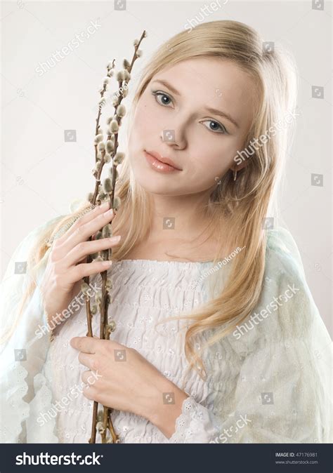 Studio Portrait Of A Beautiful Girl With Pussy Willow Buds Stock Photo