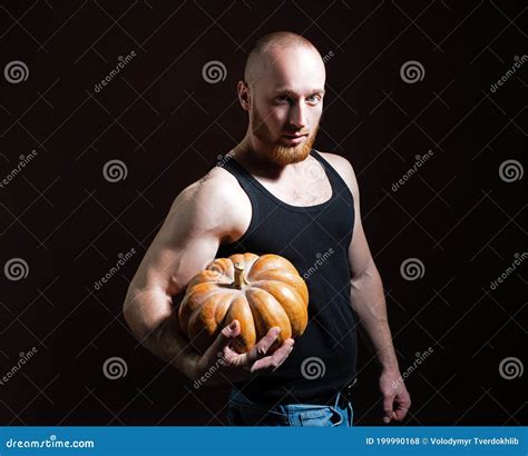 Health Food Halloween Gourd Young Man With Muscular Body Hold Pumpkin