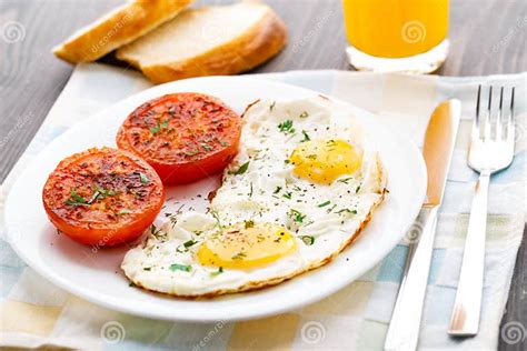 Breakfast With Fried Eggs And Tomato Stock Image Image Of Food Orange 34634445