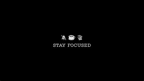 The Words Stay Focused Are Written In Black And White On A Dark