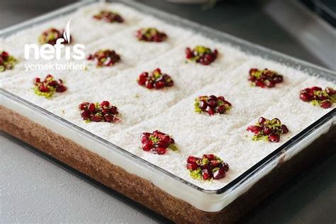 There Are Many Small Flowers On Top Of The Food In The Pan Which Is