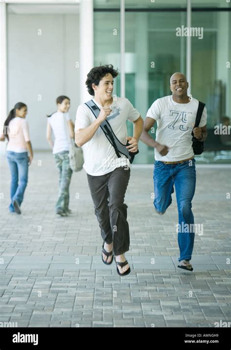 College Students Running On Campus Stock Photo Alamy