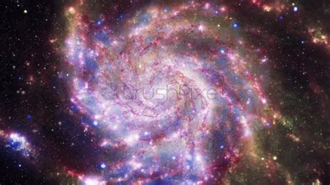 Pink spiral galaxy rotating - stock video footage | CrushPixel