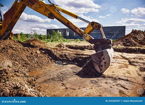 Excavator At House Construction Site Digging Foundations For Modern