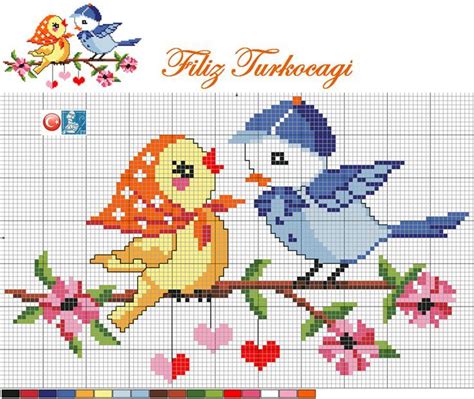 A Cross Stitch Pattern With Two Birds Sitting On A Branch And One Bird