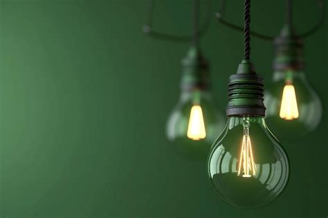 Premium Photo Incandescent Light Bulb On Green Background