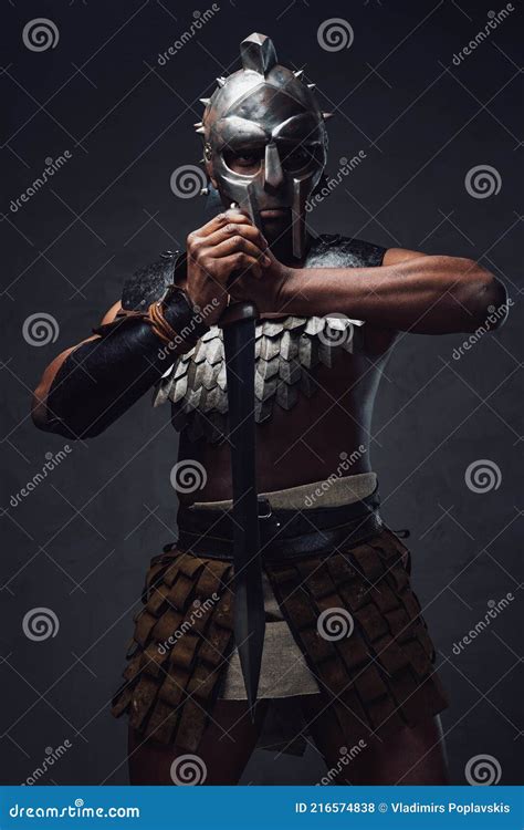 Studio Shot Of Antique Roman Gladiator Of African Ethnic With Sword