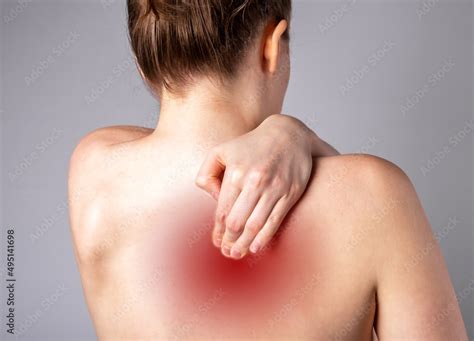 Pain Between Shoulder Blades Woman Suffering From Backache With Red