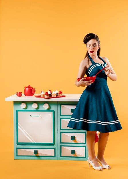 Free Photo Pinup Girl Posing In A Kitchen