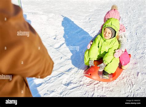 Little Kids On Sled Ride Stock Photo Alamy