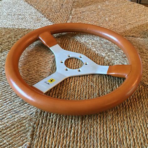 A Momo Cavallino Steering Wheel In Tan Leather