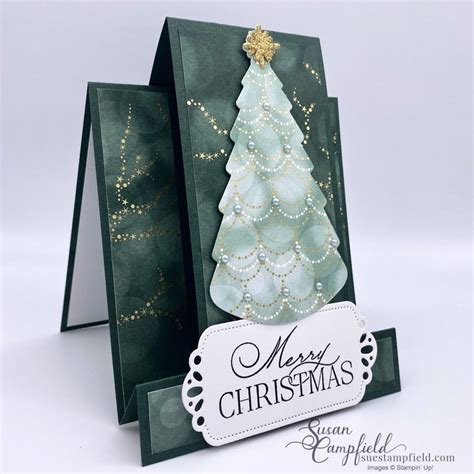 A Card With A Christmas Tree On It And A Tag Hanging From The Bottom