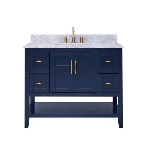 An Image Of A Bathroom Vanity With Marble Top And Blue Cabinetry On