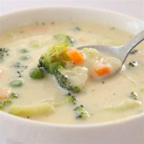 Creamy Vegetable Soup Butter With A Side Of Bread