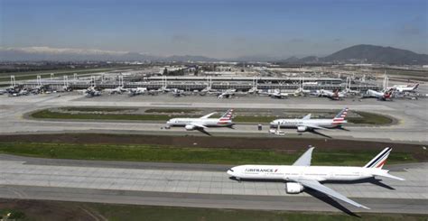 Santiago Airport gains new terminal; consortium continues to lose in ...