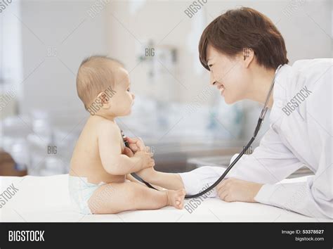 Doctor Checking Baby's Image & Photo (Free Trial) | Bigstock