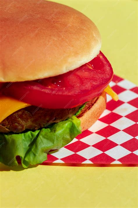Free Photo | High angle arrangement with half cheeseburger and yellow