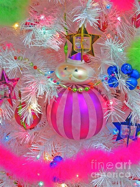A Christmas Tree With Ornaments And Lights In The Shape Of An Ornament