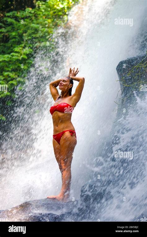 Woman Under Waterfall High Resolution Stock Photography And Images Alamy