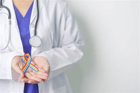 Doctor With Lgbtq Rainbow Ribbon For Support Lesbian Gay Bisexual Transgender And Community