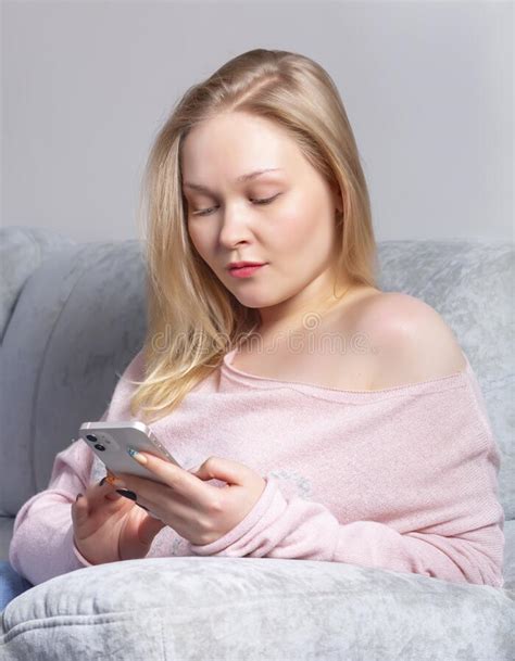 Blonde Girl With A Smartphone In Her Hands Stock Photo Image Of Home Caucasian