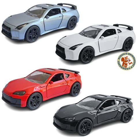 Miniatura Carrinho De Ferro Toyota Supra Mclaren Nissan Skyline Abre As