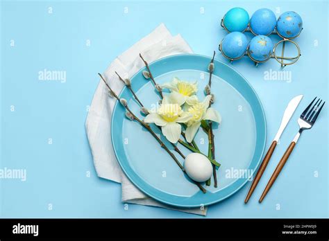 Plate With Beautiful Daffodils Flowers Pussy Willow Branches And Painted Easter Eggs On Blue