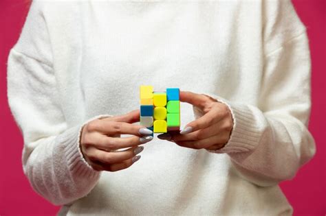 Free Photo Woman Holding Rubik S Cube In Hands