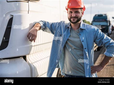 Smiling Truck Driver Standing By Truck Stock Photo Alamy