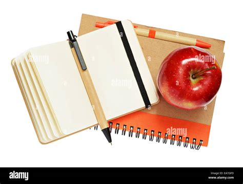 Notebooks Pens And Apple Isolated On White Stock Photo Alamy