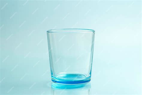 Premium Photo Clear Drinking Glass Isolated On Blue Background