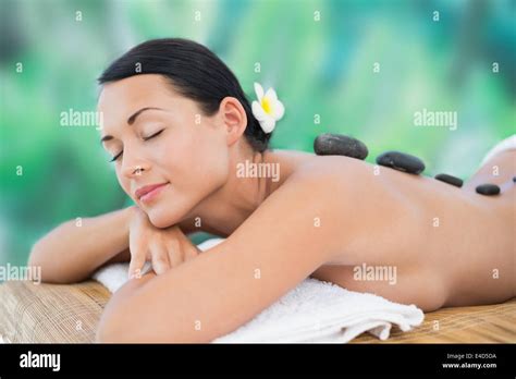 Beautiful Brunette Enjoying A Hot Stone Massage Stock Photo Alamy