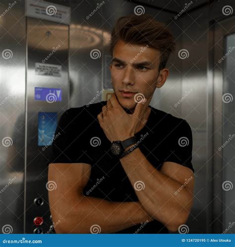 Fashionable Handsome Model Man In Black T Shirt In Elevator Stock Image