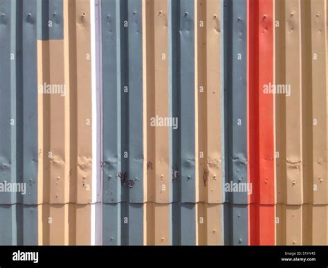 Sheet metal wall painted in different colors Stock Photo - Alamy