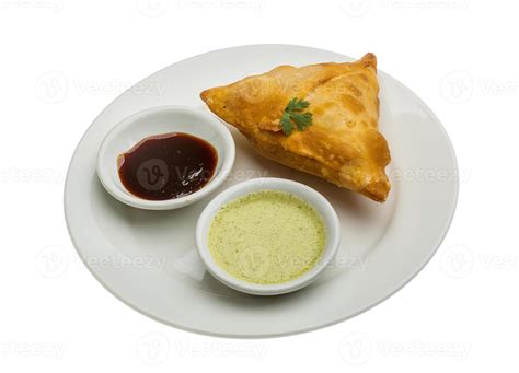 Samosa on the plate and white background 11239406 Stock Photo at Vecteezy