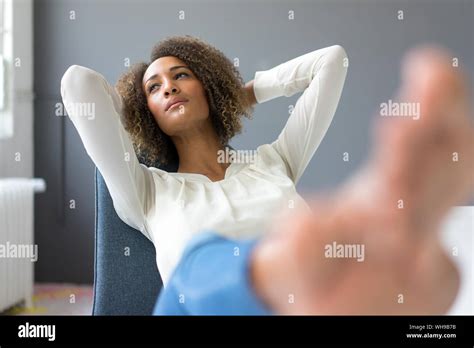 Woman Feet Up On Desk