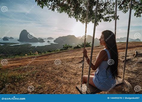 Beautiful Girl On A Swing On Vacation In Asia View Of The Phang Nga